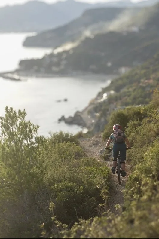 Rider on a trail above the Ligurian coast