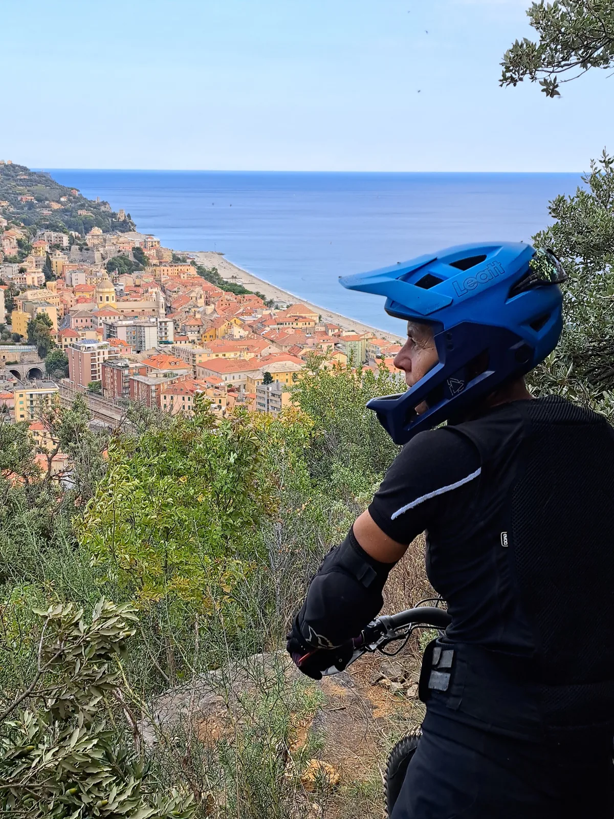 Cycling break overlooking a coastal village