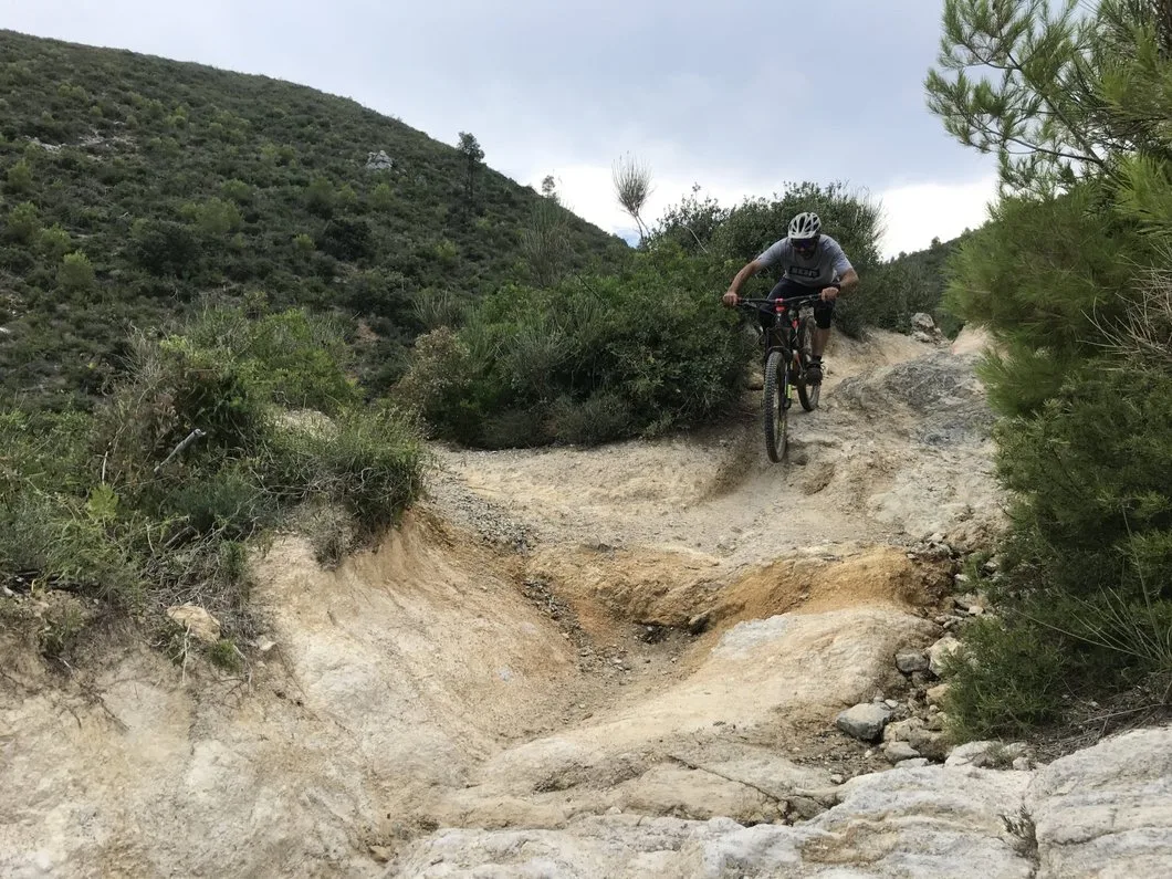Rider descending a rocky trail