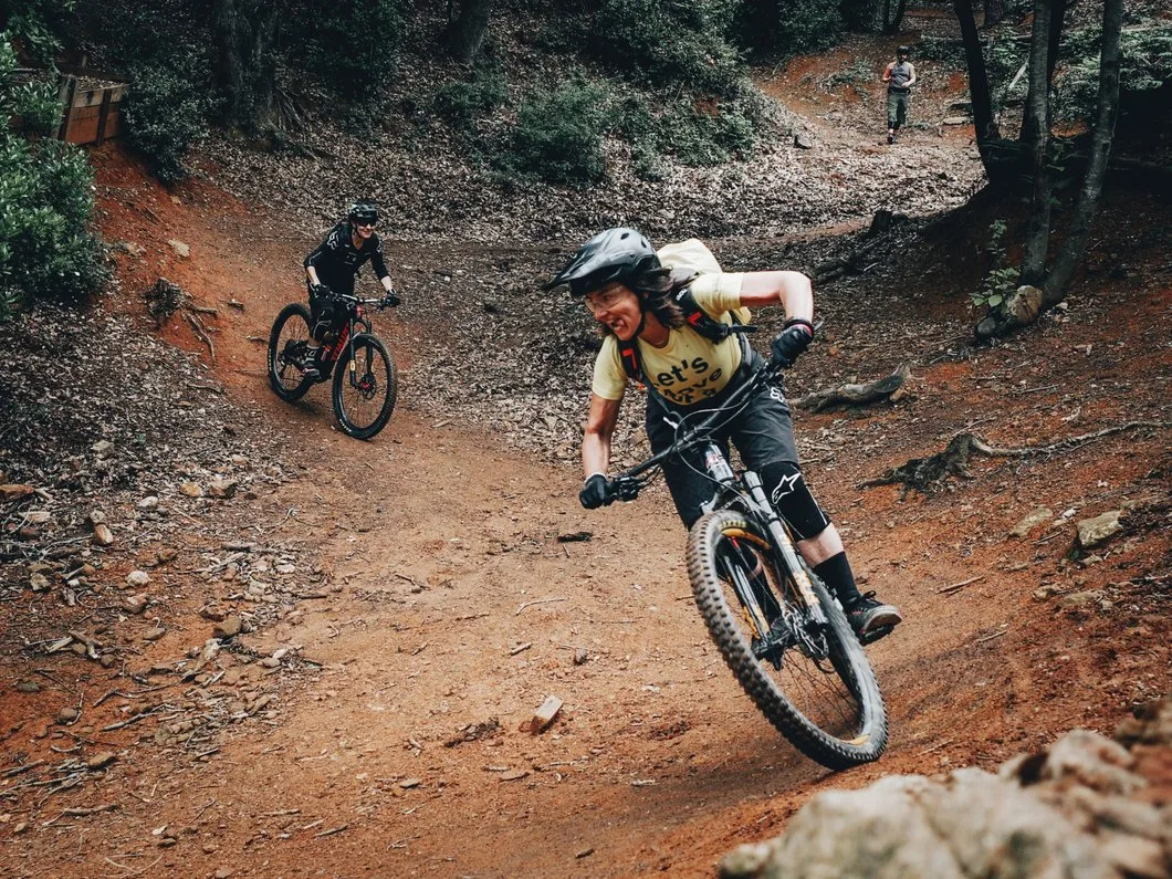 Group of riders cornering on the trails